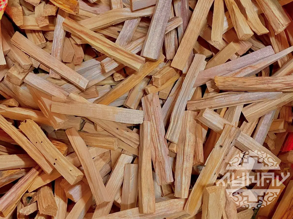 Wood pieces of premium Palo Santo sticks ready for incense production and export from Peru, showcasing the light brown and natural texture of the sacred wood